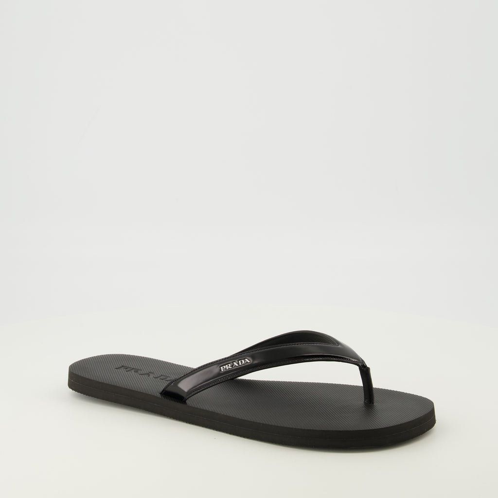 Image of the article Black brushed leather flip flops by Prada for Men - Spring-Summer 2026 - Three-quarter front right view