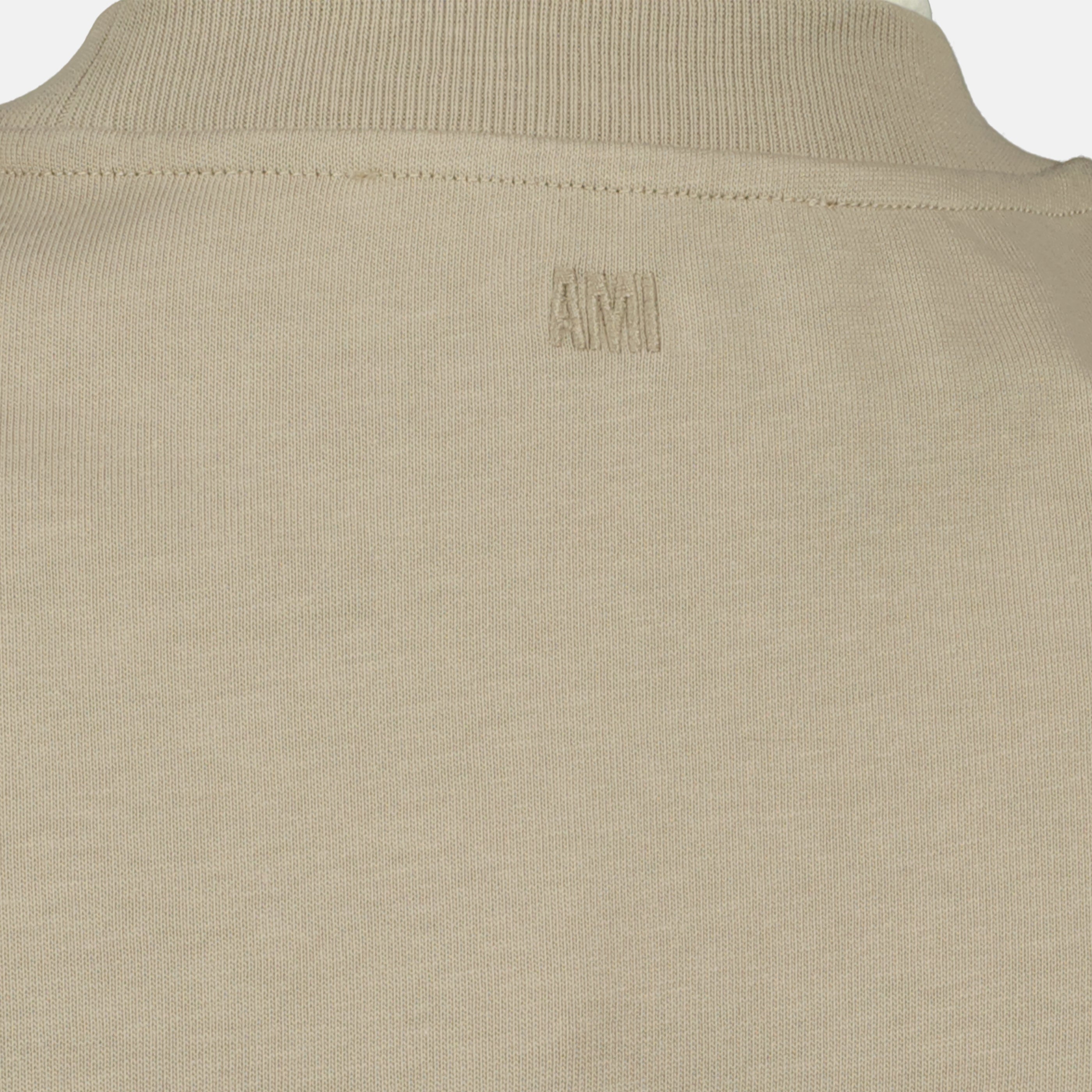 Image of the article Beige AMI Heart Cotton T-shirt from the brand Ami PARIS for Unisex - Spring-Summer 2026 Season - Detailed View_2