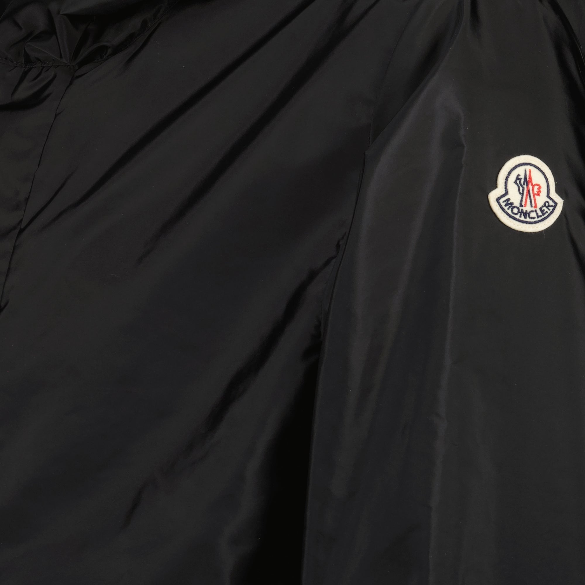 Image of the Grandas black windbreaker from the Moncler brand for Men - Spring-Summer 2026 - Detailed View_1