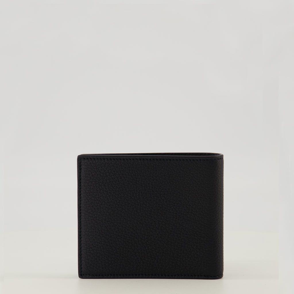 Image of the Tiny Cassandre black and gold wallet from the brand Saint Laurent for Men - Spring-Summer 2026 - Back View