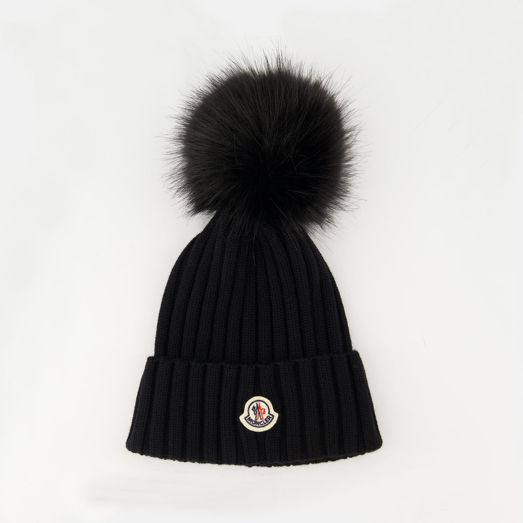 Image of the article Wool beanie with pompom from the brand Moncler for Women - Autumn-Winter Season 2025 - Front View