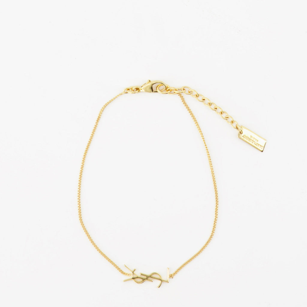 Imagen del brazalete Cassandre dorado de la marca Saint Laurent para Hombre - Temporada Primavera-Verano 2022 - Vista Frontal