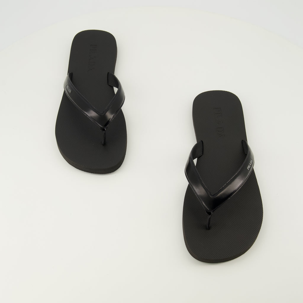 Image of the article Black brushed leather flip flops by Prada for Men - Spring-Summer 2026 - Top view of the pair of shoes