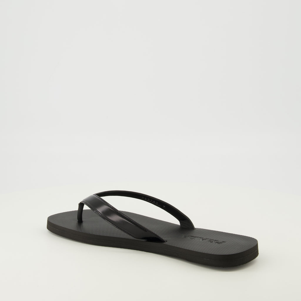 Image of the article Black brushed leather flip flops by Prada for Men - Spring-Summer 2026 - Three-quarter back right view