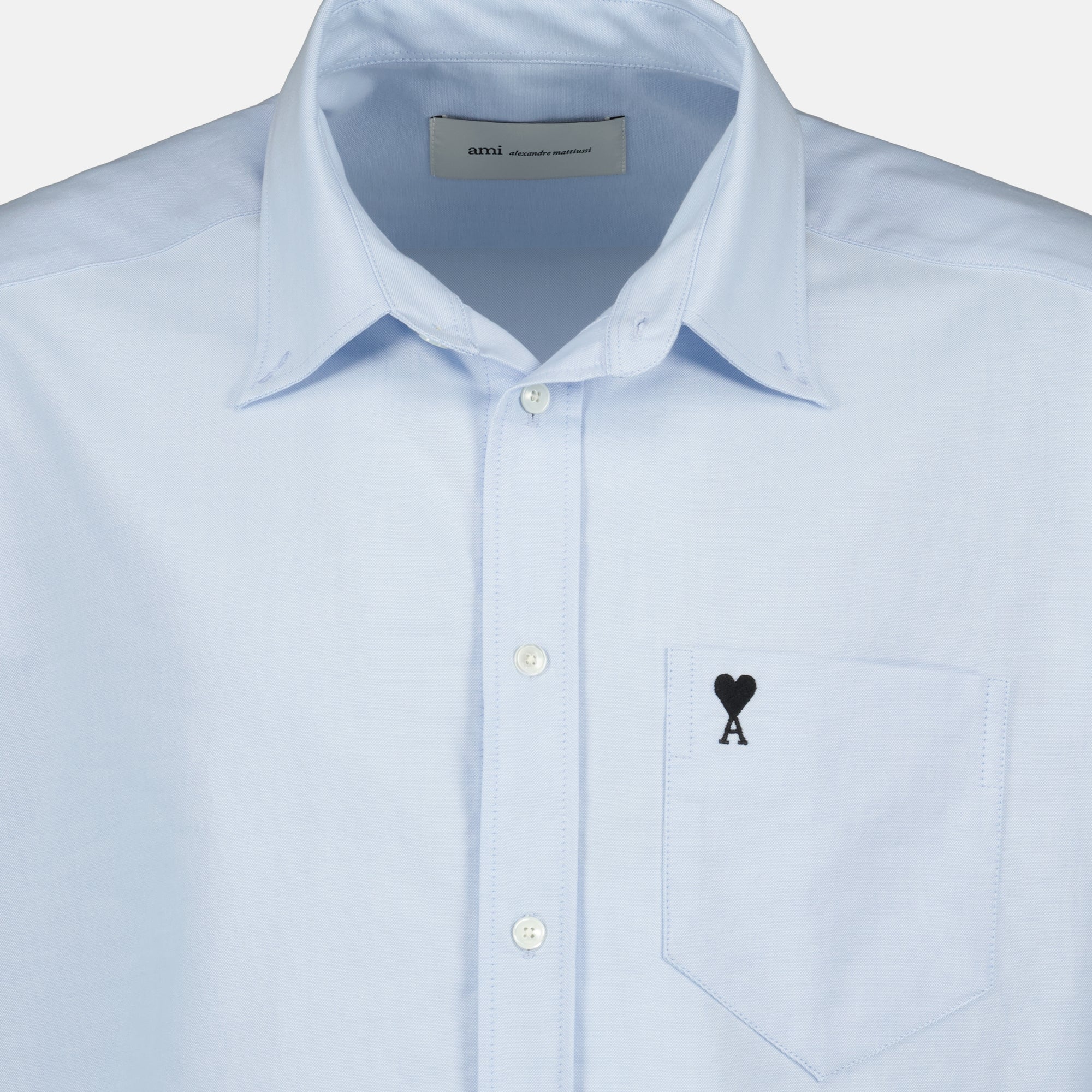 Image of the AMI blue heart boxy shirt for men by Ami PARIS - Spring-Summer 2026 - Detailed View 1