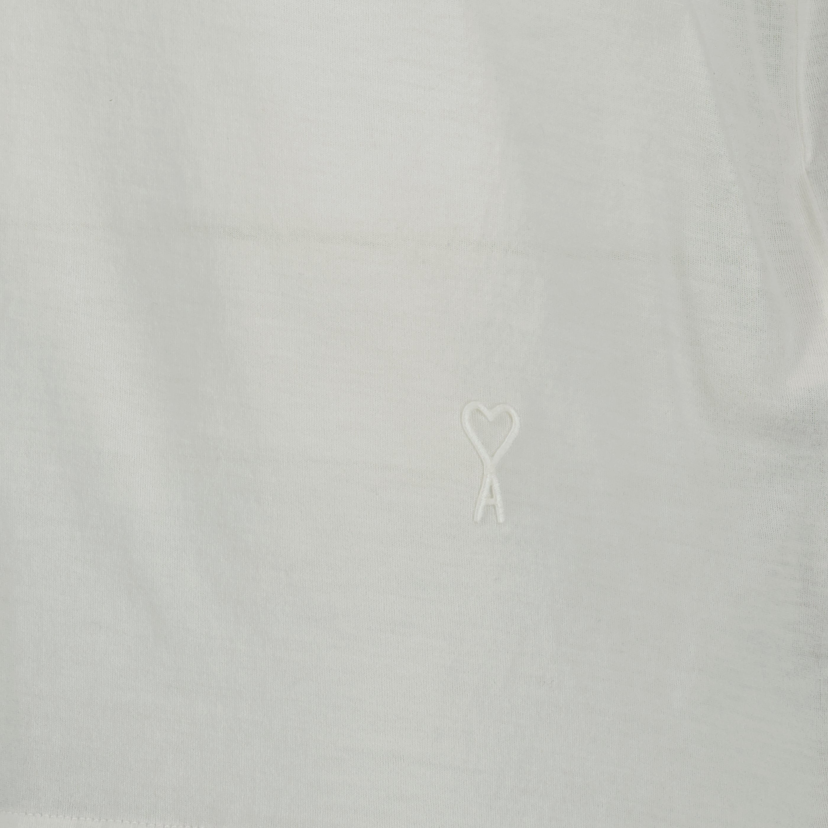 Immagine del canottiera bianco in cotone del marchio Ami PARIS per Uomo - Stagione Primavera-Estate 2026 - Vista Dettagliata_1