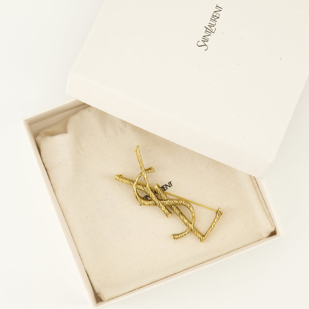 Image of the Saint Laurent Cassandre gold brass brooch for Women - Spring-Summer 2026 - Detailed View_2